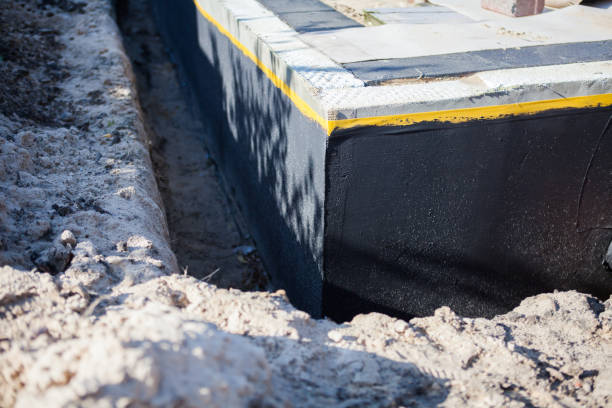 Professional Emergency Waterproofing technician working in New Palestine, IN